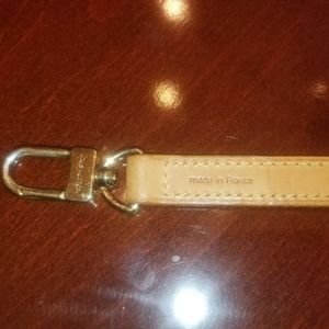 Louis Vuitton purse strap.